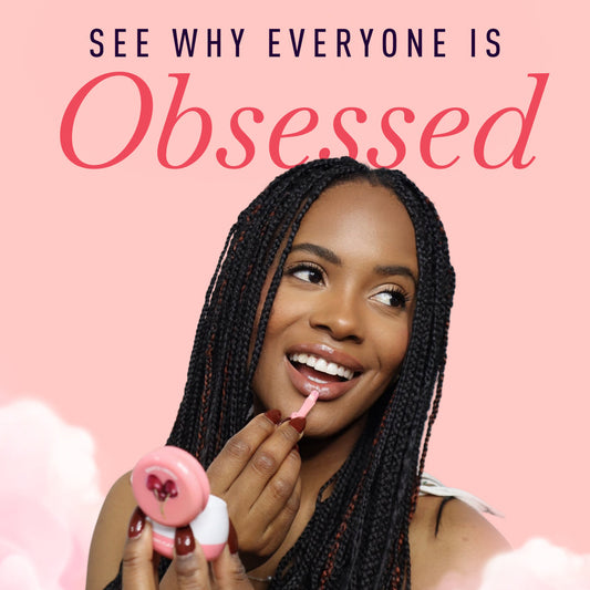 Woman applying lip balm with a pink background and 'sweetums' branding.