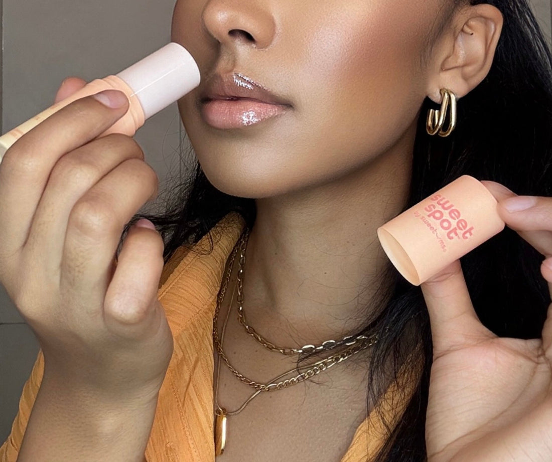 woman smelling sweet spot flavored fragrance