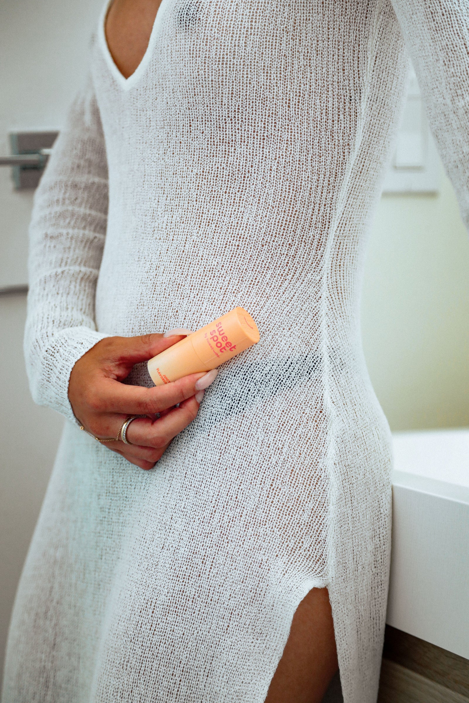 woman holding juicy peach sweet spot solid and flavored fragrance