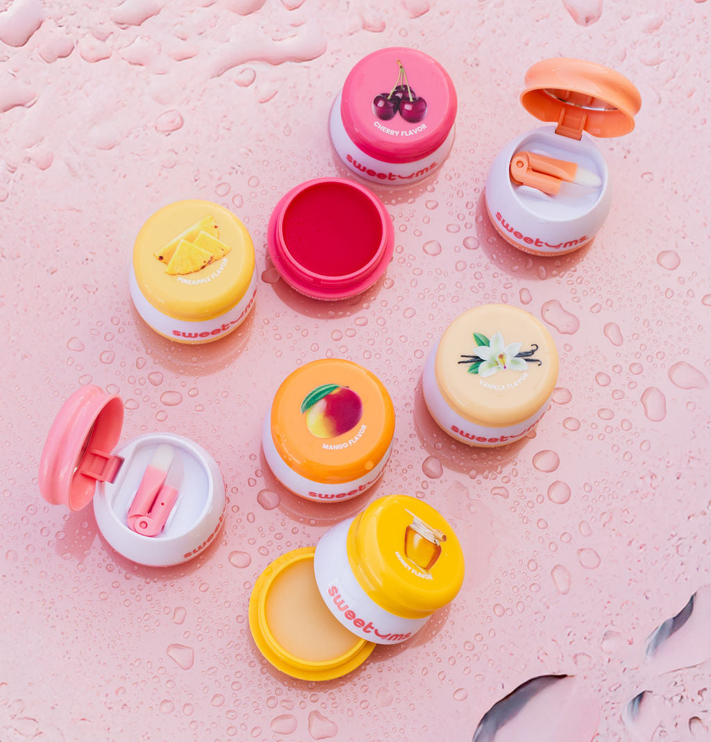 sweetums lip balms collection with water droplets