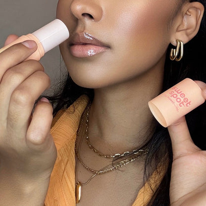 Woman smelling sweet spot solid stick fragrance