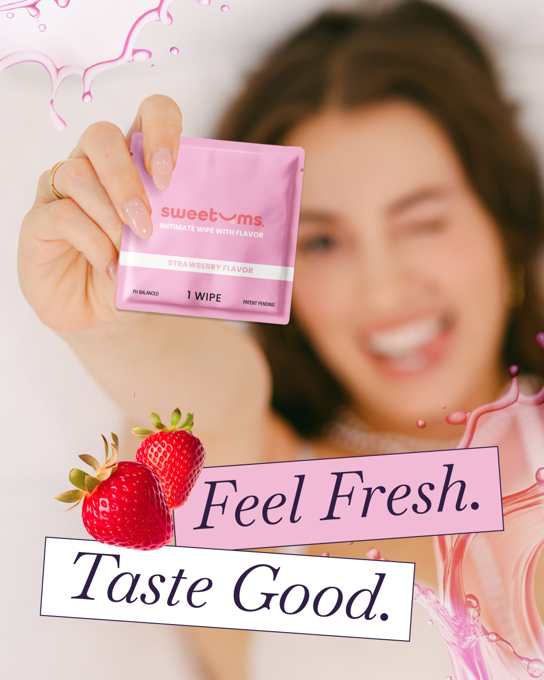 Person holding a pink package of 'sweetums' wipes with text 'Feel Fresh. Taste Good.' and strawberries.