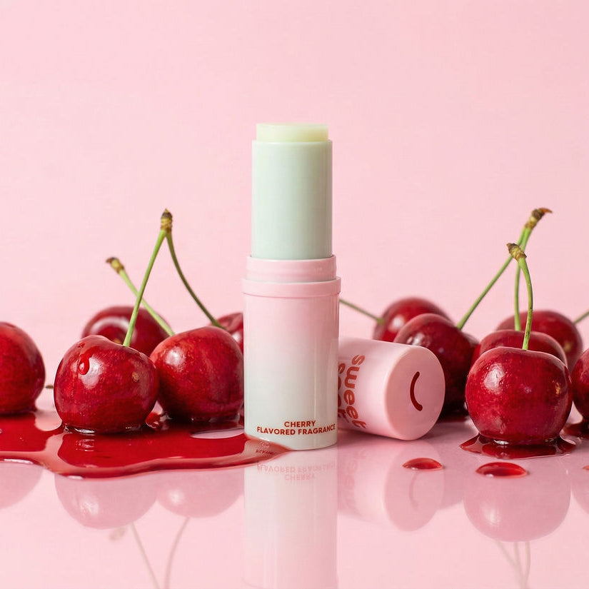 Solid fragrance with cherry flavor surrounded by cherries on a pink background
