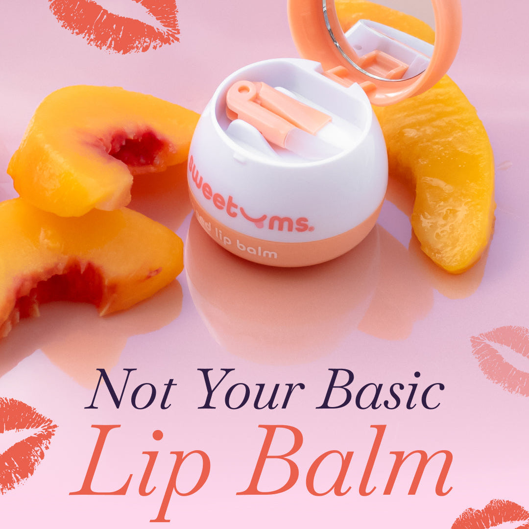 Lip balm with a mirror on peach slices against a pink background with lip prints.