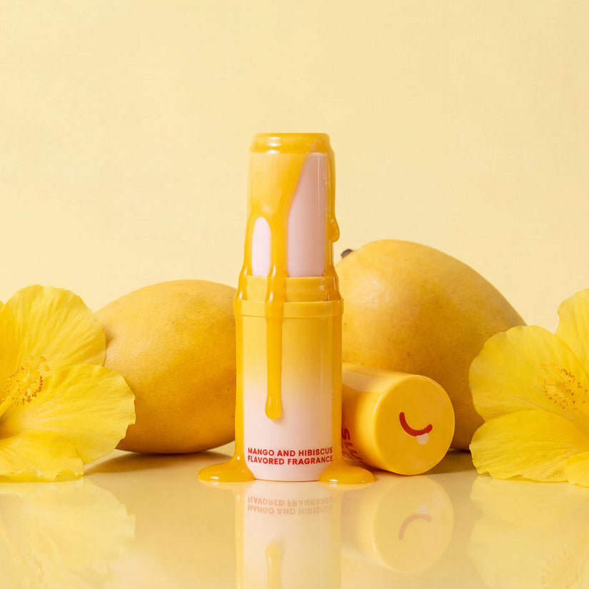 Mango Hibiscus Flavored Fragrance with mangos and flowers around it