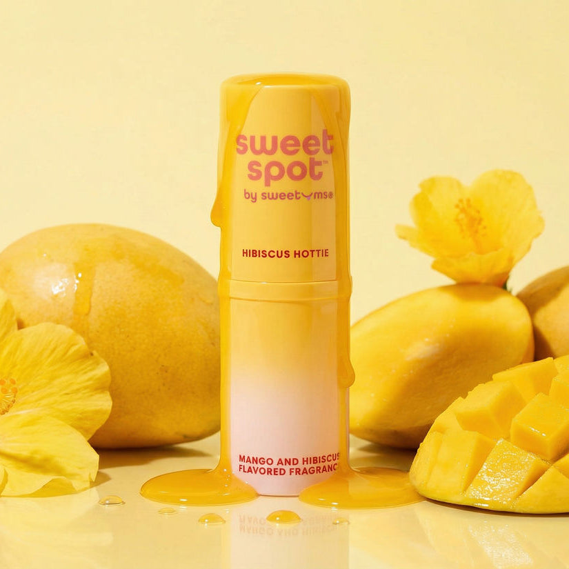 Mango Hibiscus Sweet Spot flavored fragrance surrounded by flowers and mangos
