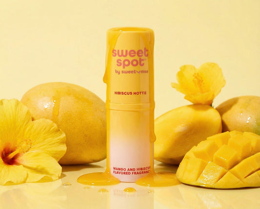 Mango Hibiscus Sweet Spot flavored fragrance surrounded by flowers and mangos