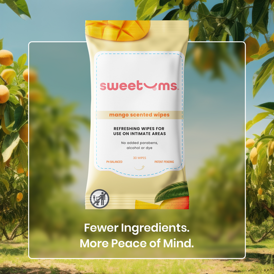sweetums mango scented wipes packaging with a mango tree in the background