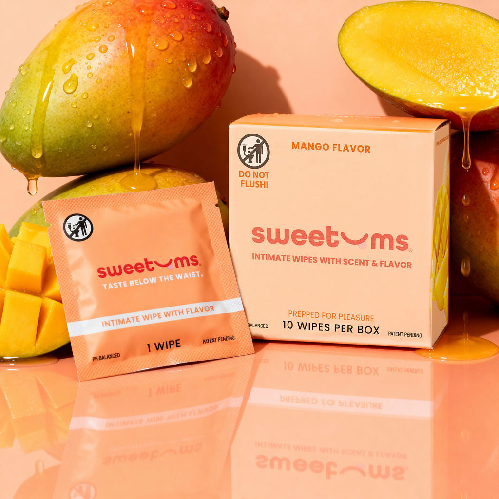 sweetums Mango Flavor intimate wipes packaging with mangoes on a peach background