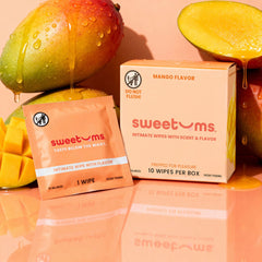 sweetums Mango Flavor intimate wipes packaging with mangoes on a peach background