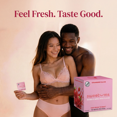 Two people in pink underwear with a box of strawberry-flavored intimate wipes on a beige background.