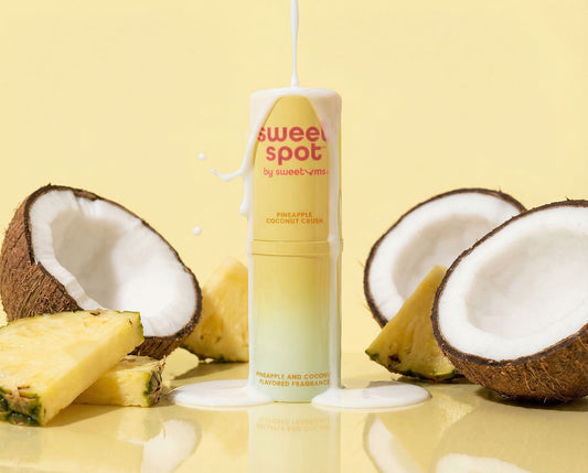 Sweet Spot pineapple and coconut fragrance product with coconuts and pineapples on a yellow background