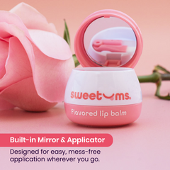 Rose flavored lip balm with mirror and applicator on a pink background with a rose.