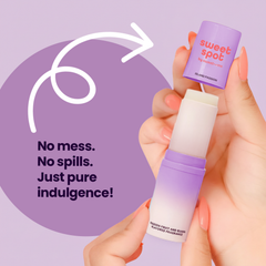 Hand holding an Island Passion sweet spot solid fragrance against a purple background.