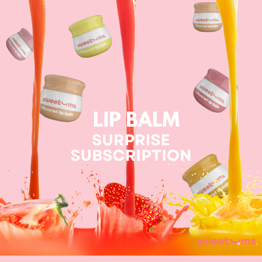 Lip balm surprise subscription with colorful lip balms and a strawberry on a pink background.
