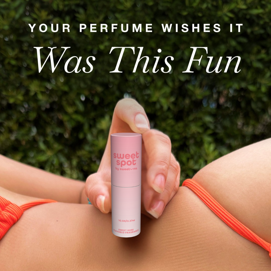 woman holding solid flavored fragrance stick next to her stomach wearing a bikini