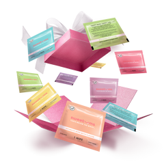 A collection of colorful boxes of Sweetums intimate wipes floating in the air with a open box at the center.