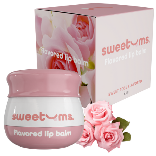 Pink and white lip balm with packaging and roses on a white background