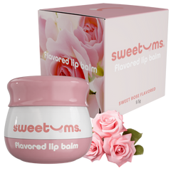 Pink and white lip balm with packaging and roses on a white background
