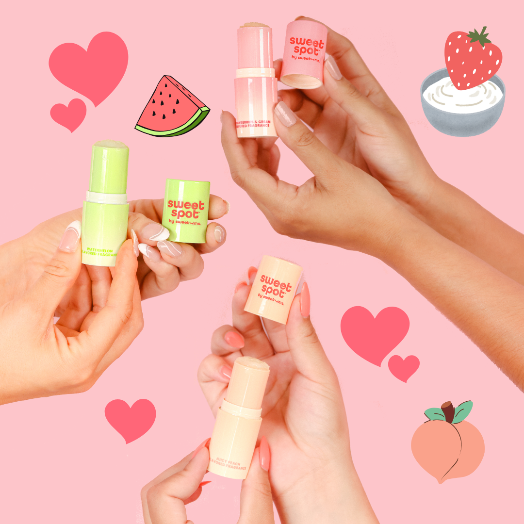 Three small bottles of flavored fragrance from Sweet Spot, each in different colors and flavors represented by the colors of fruit icons (strawberry, peach, and watermelon) in the background.