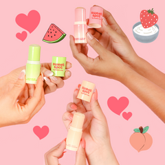 Three small bottles of flavored fragrance from Sweet Spot, each in different colors and flavors represented by the colors of fruit icons (strawberry, peach, and watermelon) in the background.